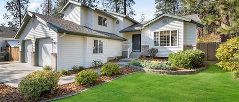 Whispering Pines Post Falls. Driveway has room for 4 cars, plus RV parking on left. Hope to welcome you soon!