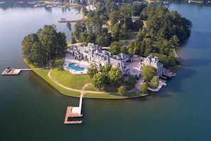 Home, boathouse (separate rental) three docks, and pool