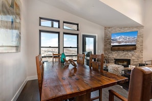 Dining table: "Sunlit space with a view, perfect for family meals and gatherings."