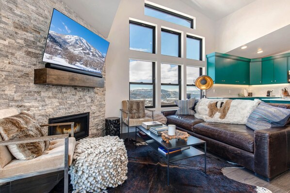 Cozy ambiance with fireplace, perfect for relaxing by the window.