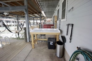 Fish cleaning table with water supply and outdoor shower