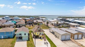 Mellow Yellow in Dolphin Point Subdivision view from Maple Street (note no driveway entrance on Maple St. side)
