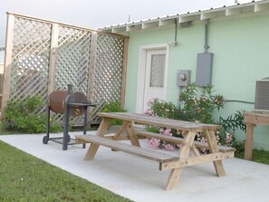 Semi private back porch with BBQ and Picnic table