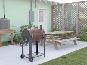 Semi Private back patio with BBQ and Picnic table