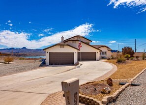 with spacious driveway and mountain views.