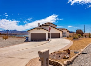with spacious driveway and mountain views.