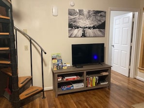 Living Room with spiral staircase to upstairs bedroom  Smart TV with Netflix and Prime