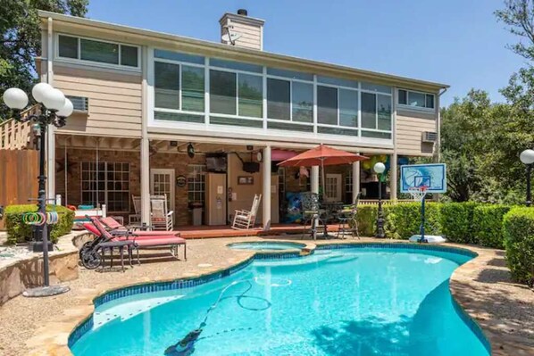 Back of house.  Heated Pool, Jacuzzi, Lower Deck, Upper Sun Room