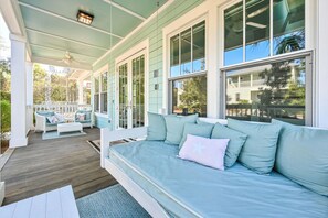 Relax and unwind with the comfortable and inviting seating, perfect for enjoying the fresh air and peaceful surroundings.