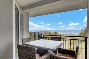 Balcony seating overlooking the ocean.