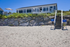 Large deck that overlooks the homes private stairway leading to the beach/ocean.