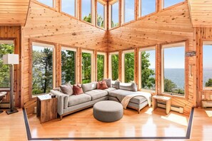 Floor to ceiling windows in the sunken in living room to enjoy unobstructed views of Lake Superior. 
