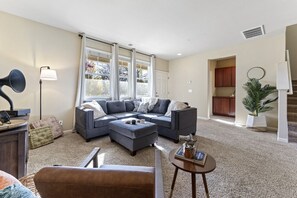 Unwind in style in this open-concept living space, perfect for relaxing and entertaining.