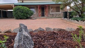 Paved front yard, ample parking.
