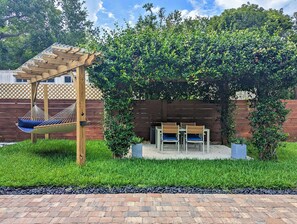 Enjoy your time outside lounging in our covered hammock or under the string lights on the pergola