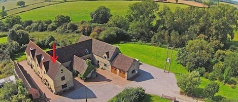 Aerial shot of Highwood Farm with the arrow denoting Lavender Cottage.