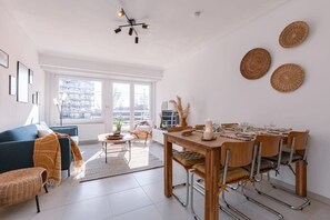 Sunny living room with vintage dining area