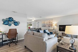 Work from paradise with an office desk, comfy chair, and 1 GB Wi-Fi.