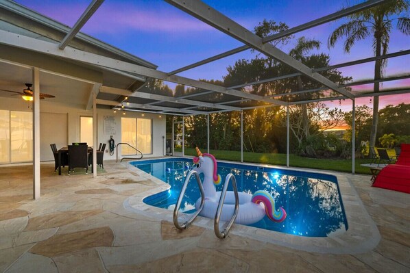 Enjoy the completely new private heated pool with outdoor dining & relaxing space.