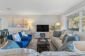 Cozy spacious living room with large HDTV, Netflix, and new sleeper sofa.