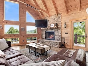 Main Floor Living Room with Floor to Ceiling Windows.