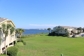 Bay water views over the large grassy lawn