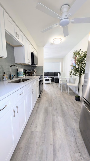 Kitchen with view to the dining and living