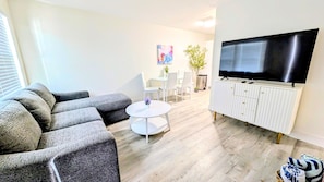 Living Room with large sectional sleeper, Large screen TV with Spectrum Cable