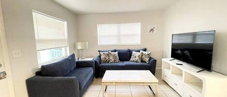 The Living Room has comfortable seating. The sofa is a sleeper sofa queen size.