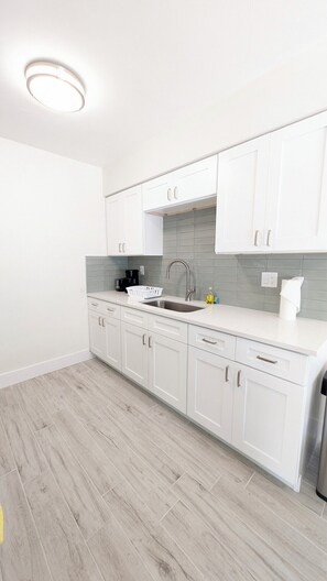 Stunning white kitchen with quartz counters