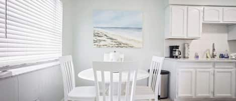 Dining Room Table and chairs seating 4. More can sit in the living room utilizing coffee table.