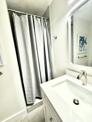 Bathroom with Shower. PLEASE NOTE: Bathroom is bedroom 1 Ensuite. To access you need to walk through bedroom 1
