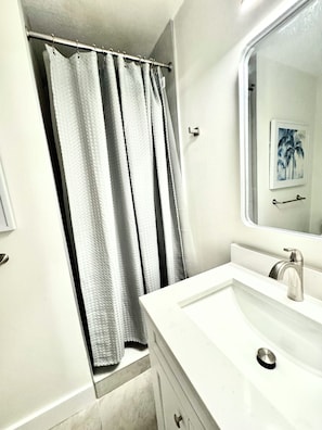 Bathroom with Shower. PLEASE NOTE: Bathroom is bedroom 1 Ensuite. To access you need to walk through bedroom 1