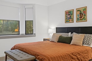Master suite with king-size bed. Bay window with blackout roller shades