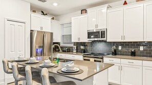 Unleash your inner chef in our modern kitchen, complete with top-of-the-line appliances for your convenience.