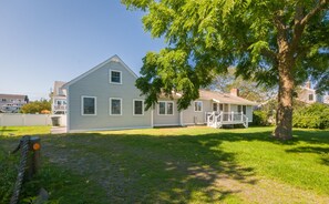 Front of the home that allows plenty of sunlight in and parking.