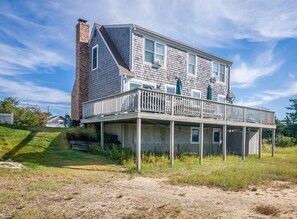 Back of the home with a large deck for family gatherings.