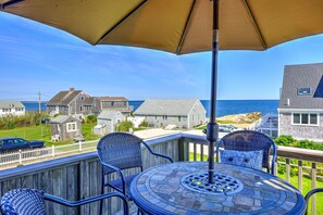 Outdoor eating area with ocean views.