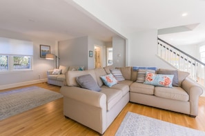 Living room with tons of natural light and space for the family.