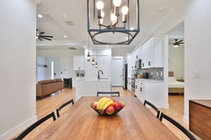 dining area seating for 6 with fully stocked kitchen