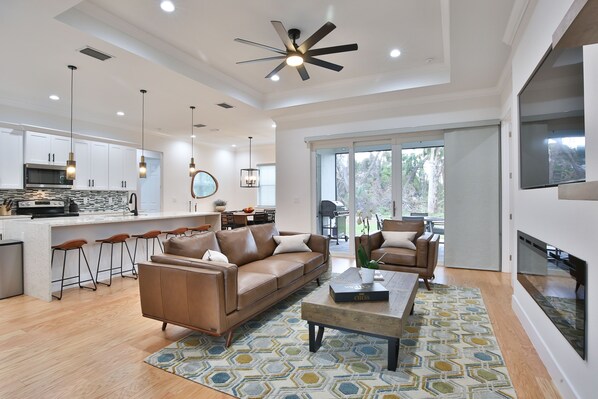 living room areas with open concept kitchen