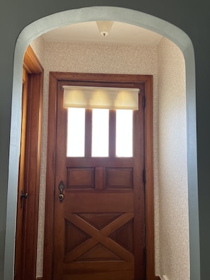 Entryway with coat closet and full length mirror