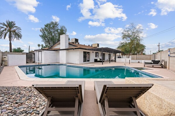 Giant heated diving pool with attached spa and diving board