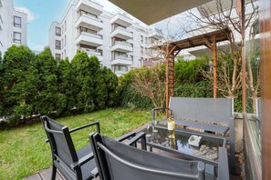 Furnished terrace and garden.
