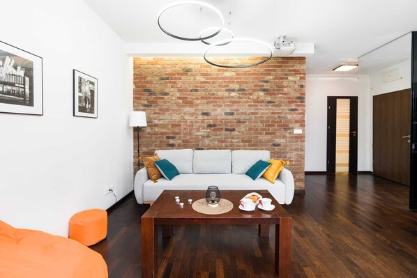 Living room with a comfortable sofa and TV. 