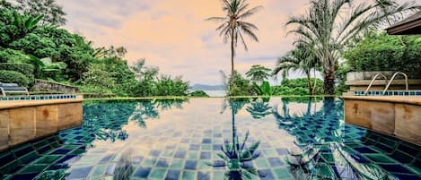 The infinity pool with views over Chalong Bay is the heart of the Glasshouse