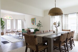 Gather together and enjoy your meals at the large dining table 