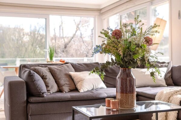 Bright and spacious living room with family dining area