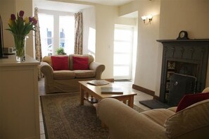 Lounge with open fire at Barton Cottage in West Burton, Wensleydale in the Yorkshire Dales