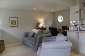 Beautiful lounge with dining and kitchen area at The Hay Loft in Bishopton, Ripon